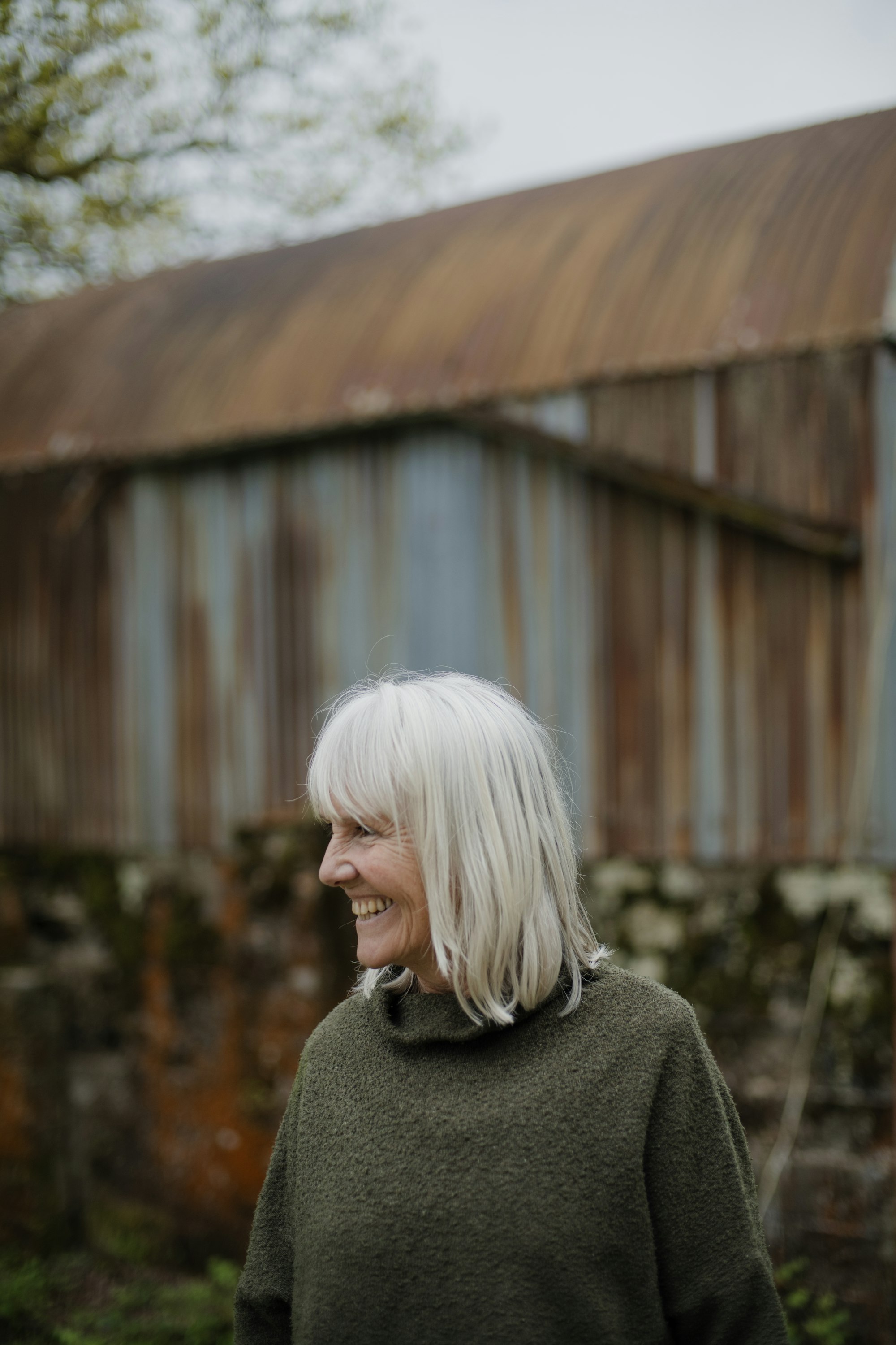 Grey-haired model smiling in profile, Argent template demo