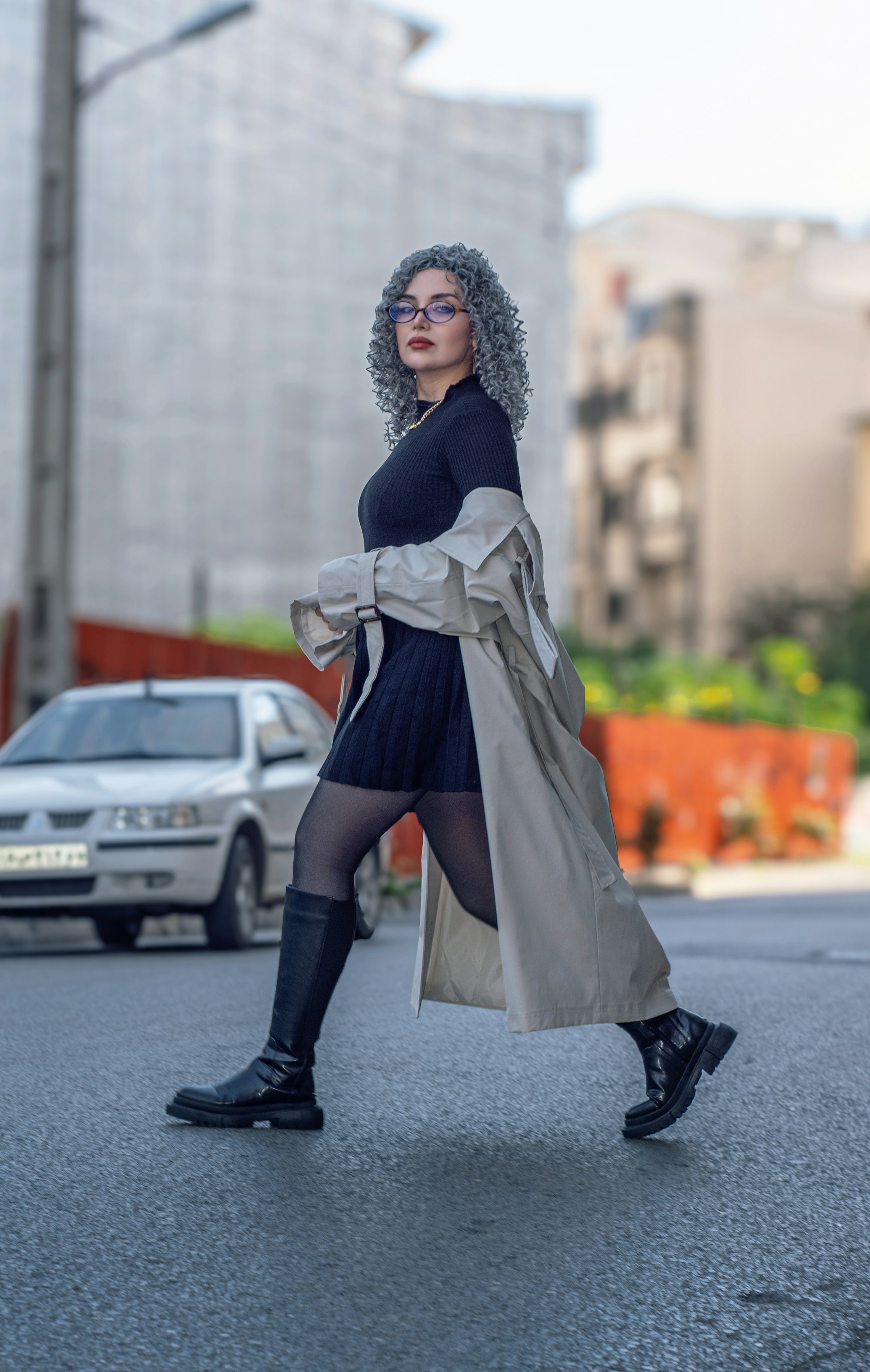 Street-style shot of a model in a long cardigan and boots, from the Boulevard template demo