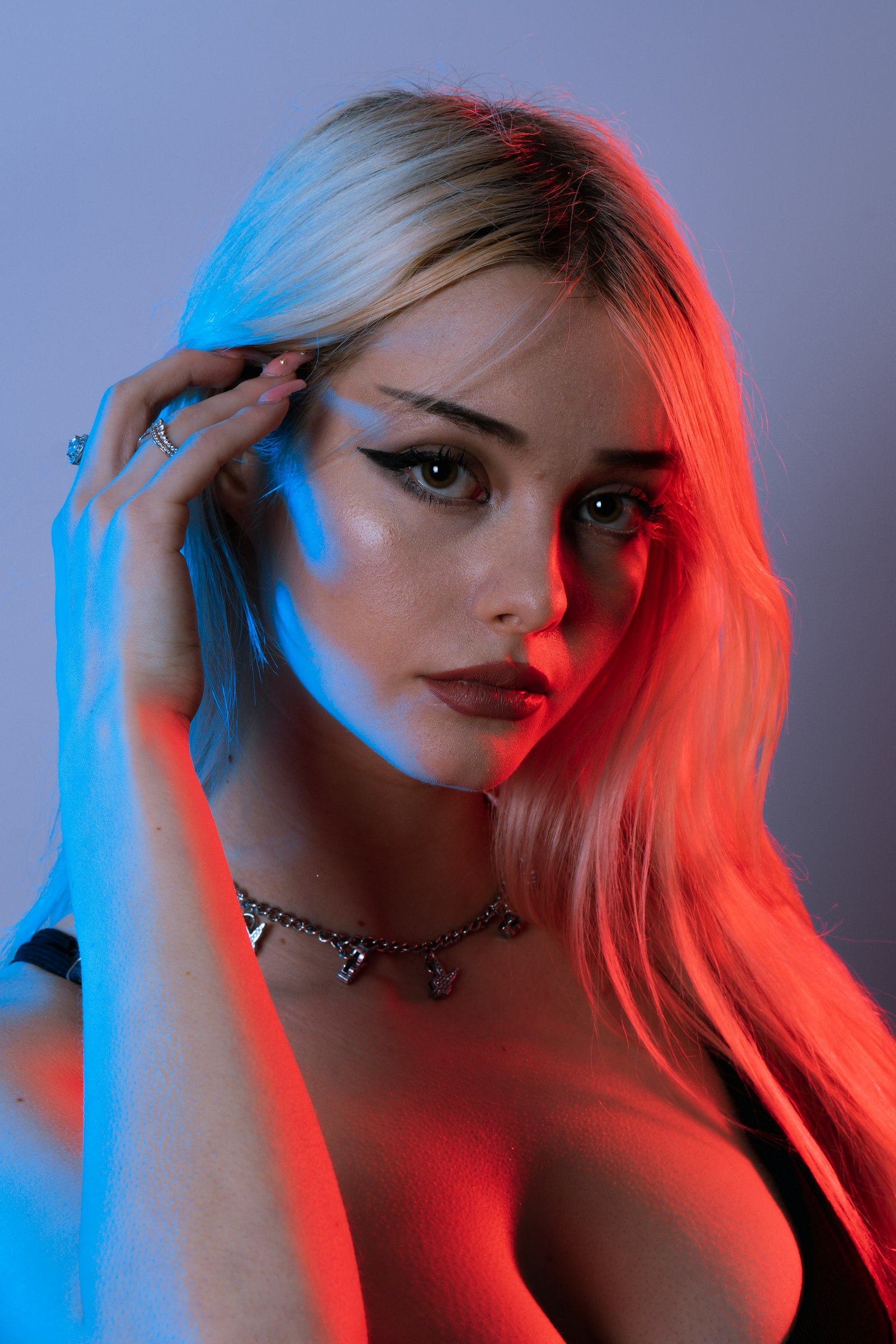 Model lit in red and blue neon, Noir template demo