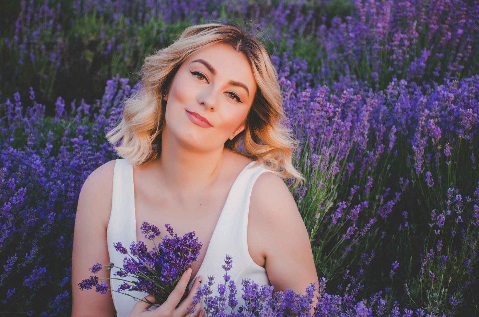 Model holding lavender in a lavender field, Bloom template demo